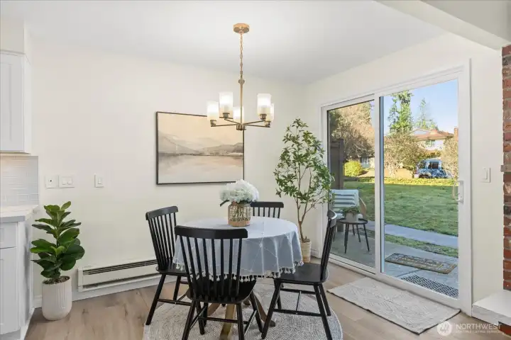 Dining space with sliders to the patio and common yard