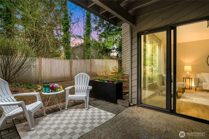 Covered patio with a storage room opposite the sliding door to store extra gear.