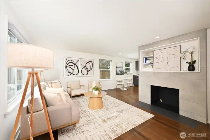 Open concept living- gas fireplace and built in space for a TV.