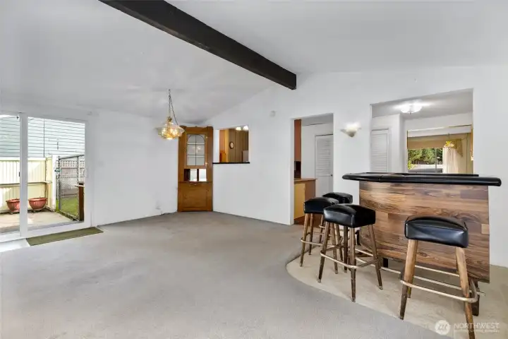 Rec room open to the kitchen and eating space.