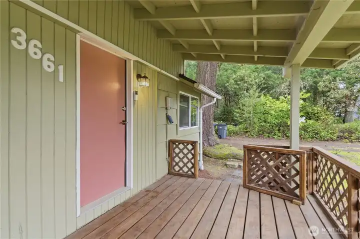 The front porch features a gate, creating a cozy, enclosed space where you can sit back, relax, and watch the world go by—with your dog right by your side.