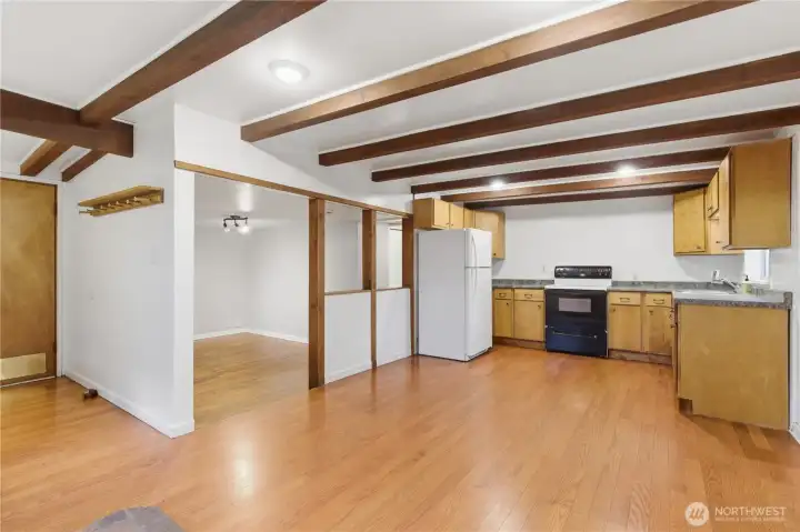 This view highlights the easy flow from the kitchen and dining area into the living room, creating a connected and comfortable living space.
