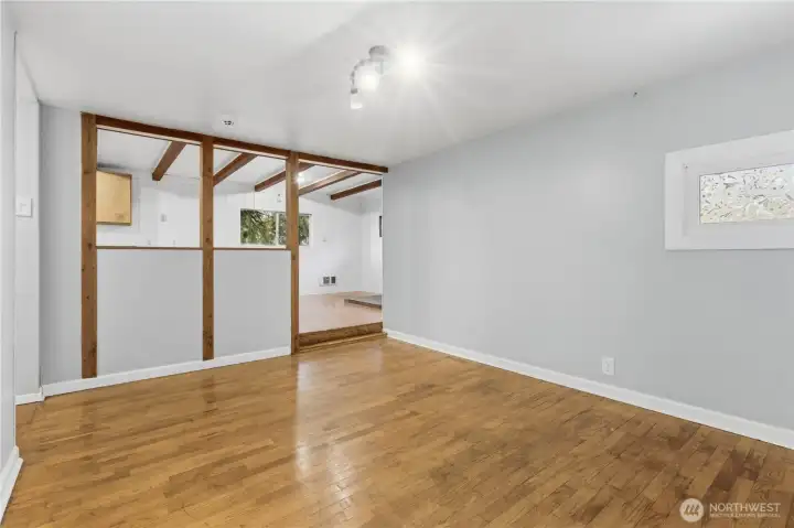 This view from the living room looks into the kitchen and dining area, showcasing the open connection between spaces and creating a comfortable flow for everyday living.