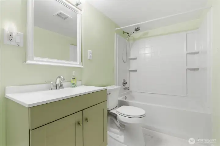 The remodeled bathroom design is simple and efficient, creating a bright, easy-to-maintain bathroom that complements the home’s overall style.