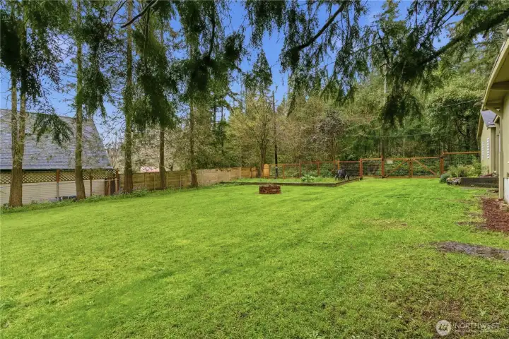 The level garden area is fully fenced, creating a secure and usable outdoor space that’s perfect for planting, relaxing, or enjoying time outside. Its flat layout makes it easy to maintain and ideal for a variety of uses.