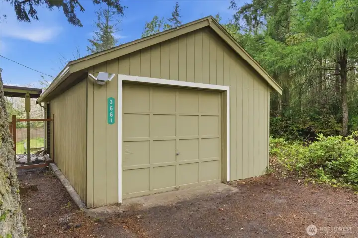 The one-car garage offers convenient covered parking along with additional space for storage, making it a practical addition to the home.