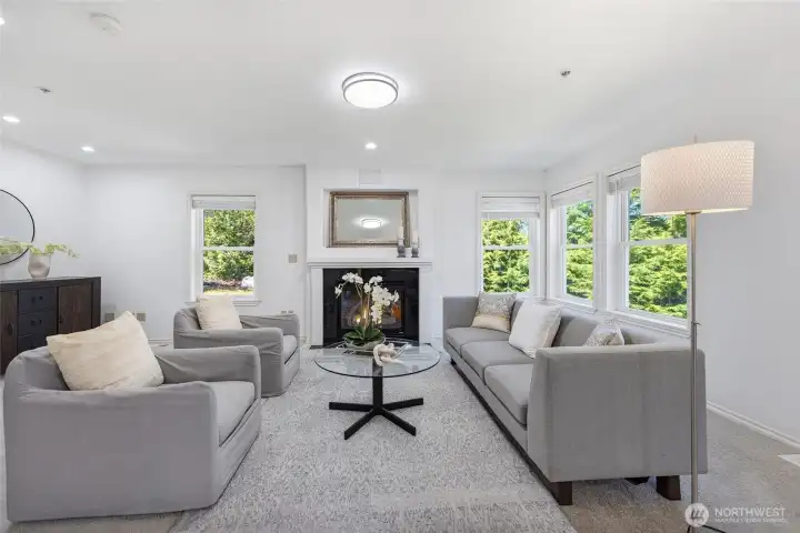 Family room with new carpet and cozy gas fireplace.