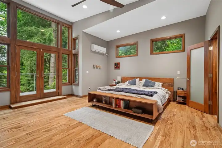 Awesome primary bedroom with soaring ceilings.