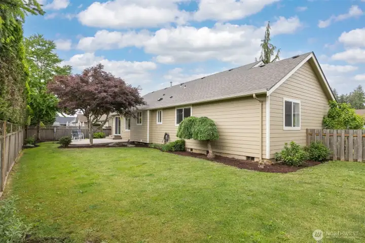 The backyard is fully fenced in, offering the perfect retreat for pups and gardeners alike. The backyard is fully fenced in, offering the perfect retreat for pups and gardeners alike.