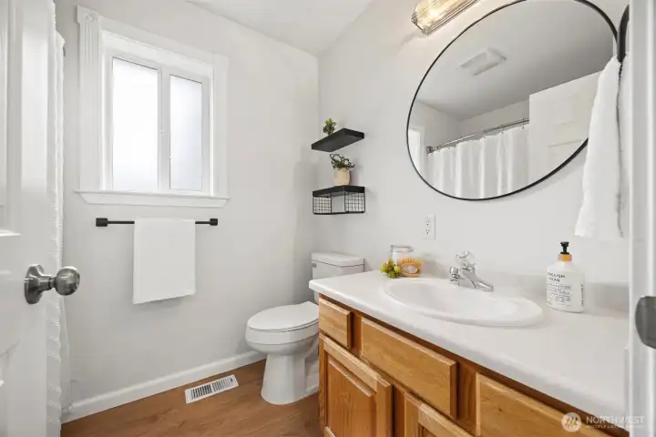 The second full bathroom features a comfort height toilet, oak cabinets & refreshed fixtures. The second full bathroom features a comfort height toilet, oak cabinets & refreshed fixtures.