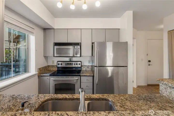 Kitchen with granite counters and stainless steel appliances