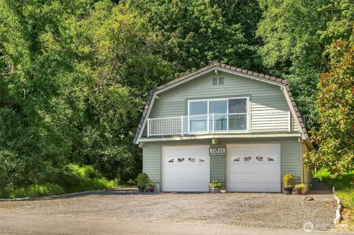 Tons of parking inside and out. Or add windows to the garage doors and convert the lower level to more living space.