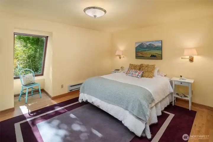 Bedroom is a sweet retreat with hardwood floors, carpeting, and a large closet for your vacation wardrobe or your daily attire.