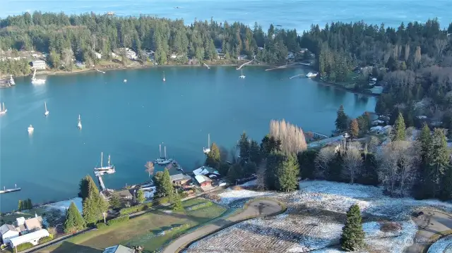 A drone view of the lot which is just right of the road, with mowing tracks. Note boat launch on S. end of the bay.
