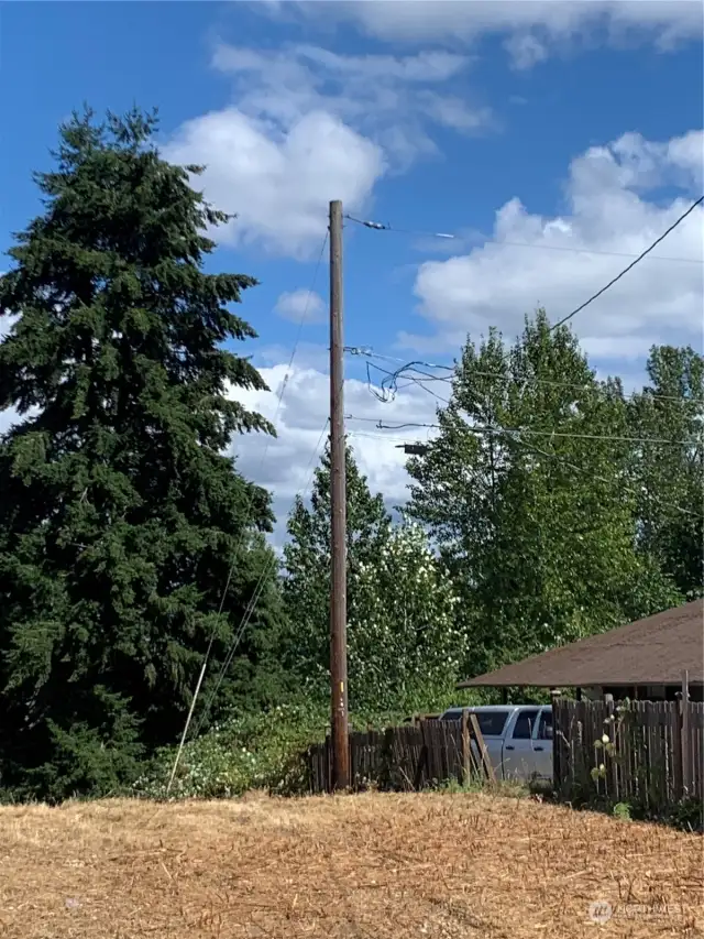 Electrical pole onsite servicing surrounding homes. Buyer to verify the ability/charges to connect.