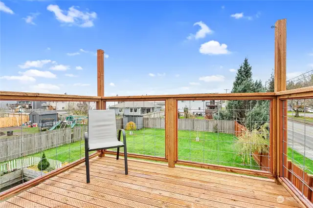 Deck located off the upstairs dining room that overlooks the large backyard