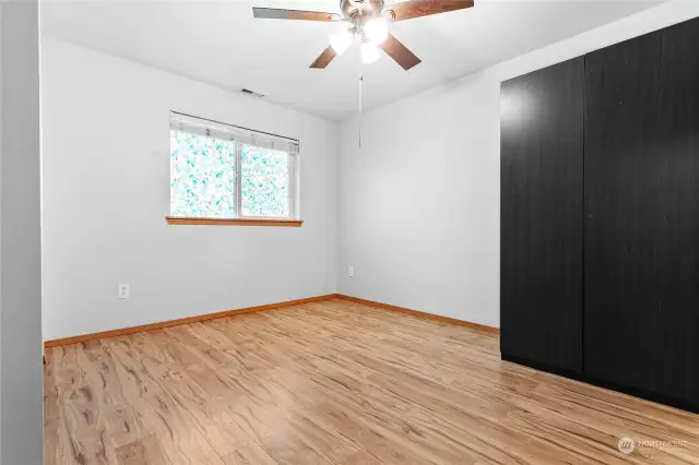 Lower level bedroom with a cabinet and a separate closet to the left (not pictured)