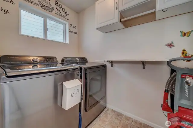 Walk-in laundry room with storage