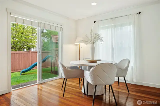 Sunny eating nook with a slider to the patio and backyard.