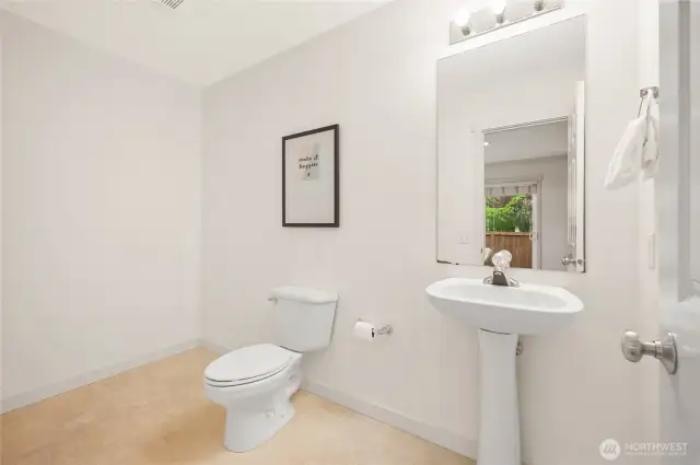 Oversized main floor half bath.