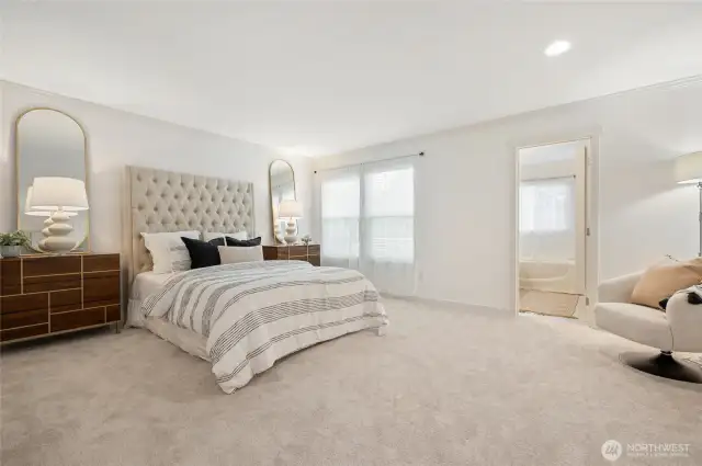 Primary bedrooms features a private bath and a large walk-in closet.