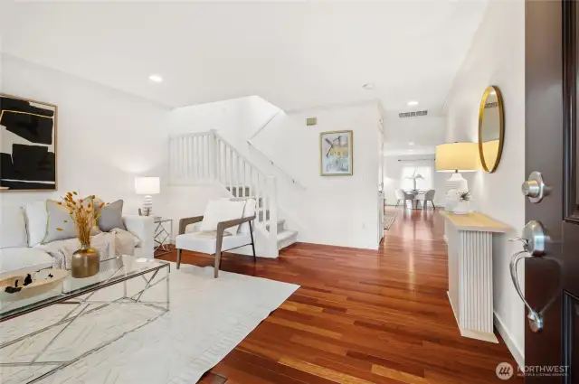 Gleaming Brazilian cherry hardwood floors at the entry and throughout the main living areas.
