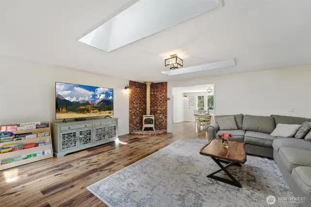 Family room features 2 skylights and free standing propane stove,