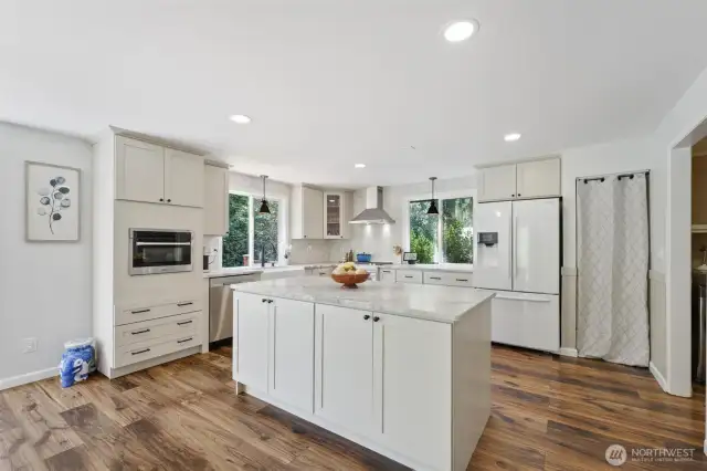 New granite kitchen includes new lighting and flooring.