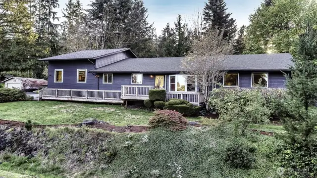 Beautiful newer exterior blue gray paint with trex decks and porch