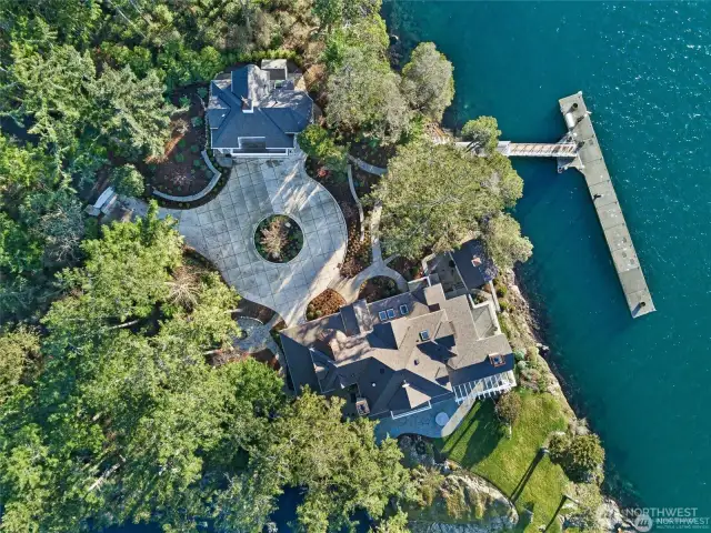 A circular drive and garage with guest suite above it for guests or caretaker.