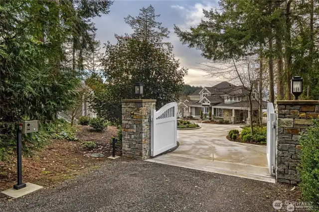 circular drive access to main home and garage, guest house and RV with power, water, pump out.