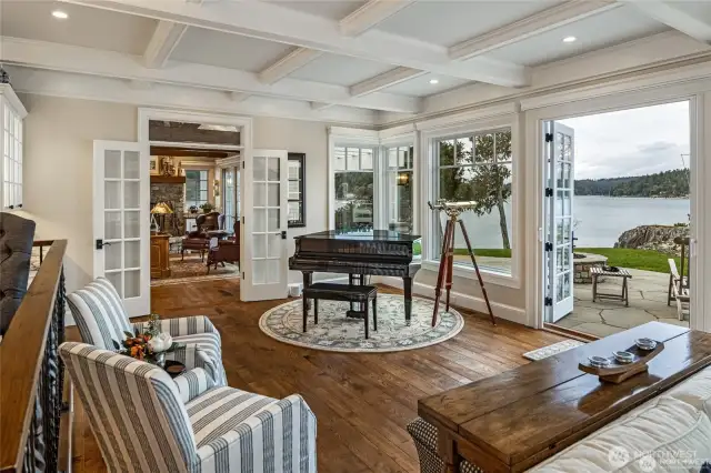 Entertain in this open concept house. The gourmet kitchen opens onto the living that extends onto the deck. The executive office is in the background.