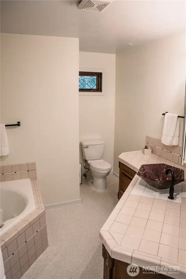 Upstairs bathroom with shower and bathtub