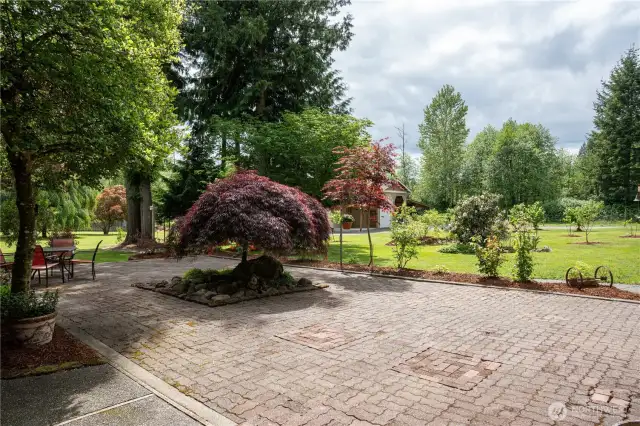 Courtyard overlooking fruit trees flowers and property.