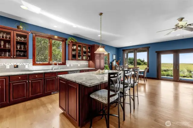 Room for all the beloveds. Casual dining at the island, or larger group in the dining area