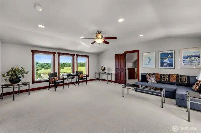 Upstairs media/bonus/rumpus room. Windows on both north and south walls.