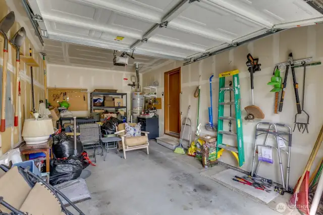 Garage has plenty of room for a car and to add storage shelves