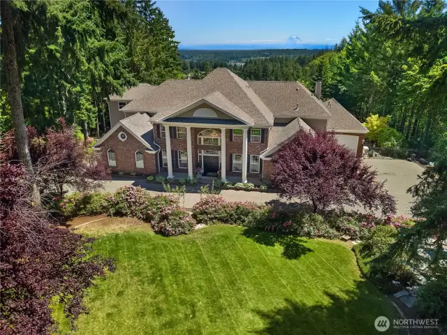 Lovely grounds with mature landscaping and circular driveway.