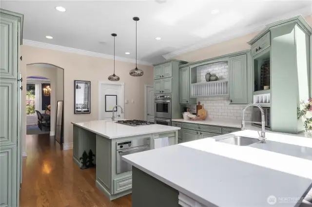This kitchen blends form and function with new quartz countertops, double ovens, steam drawer, island coolers and a butlers pantry pantry off dining area.