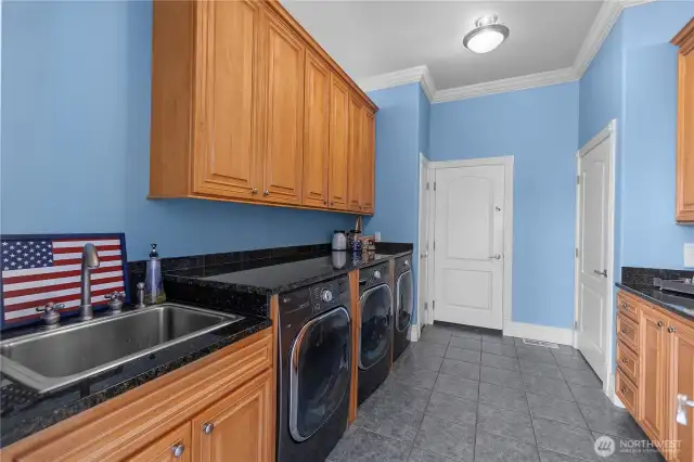 One of the two laundry areas. Featuring a total of 2 washers and 3 dryers!