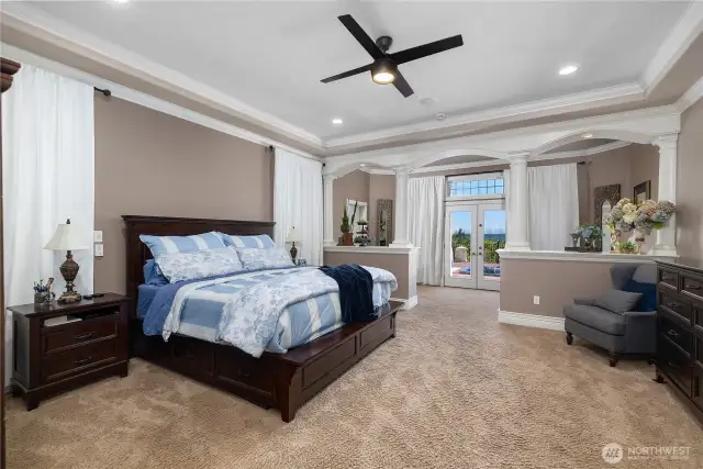 Main floor primary suite is truly a destination! Sitting area off bedroom leads to the hot tub. Not showing is the bonus craft room/flex space with 2nd washer and dryer.