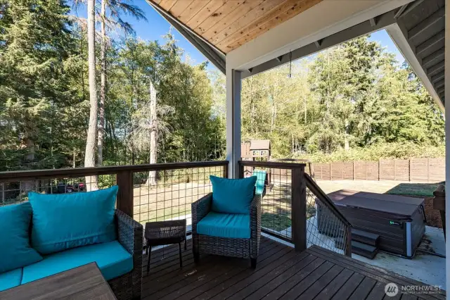 Covered deck. Large patio with hot tub