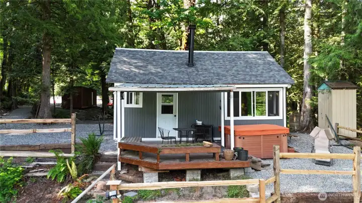 Charming cabin with covered deck ~ newer roof, paint & windows.