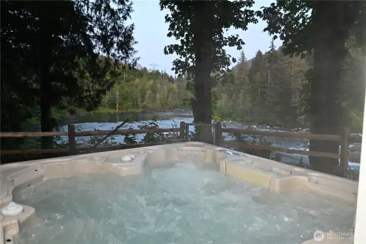 Relax in the hot tub overlooking the peaceful river ~ nature's stress remedy.