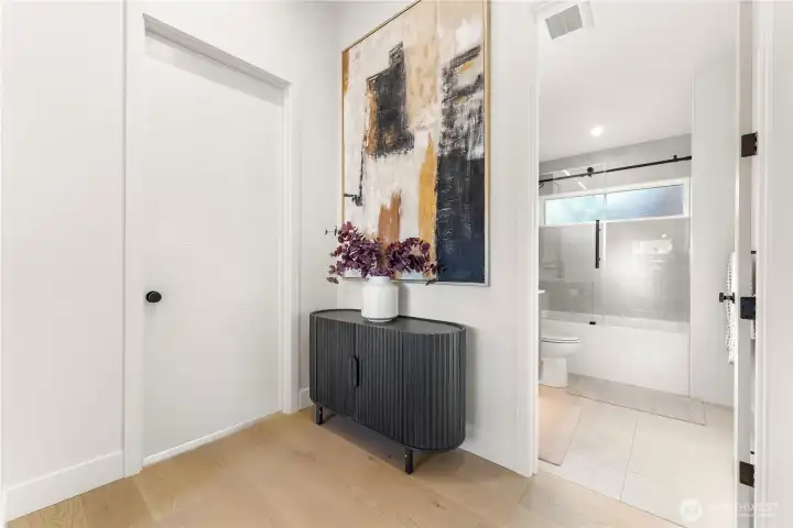 Main floor full bath. Door to the left is the walk-in pantry.