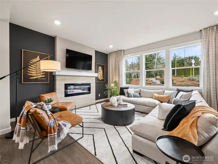 Another great view of the family room. Photo is representational. Actual home is under construction and finishes and paint colors may vary. See site agent for details....