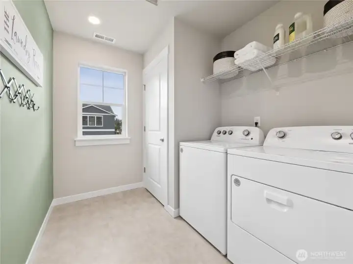 2nd level utility room with openable window. Photo is representational. Actual home is under construction and finishes and paint colors may vary. See site agent for details....