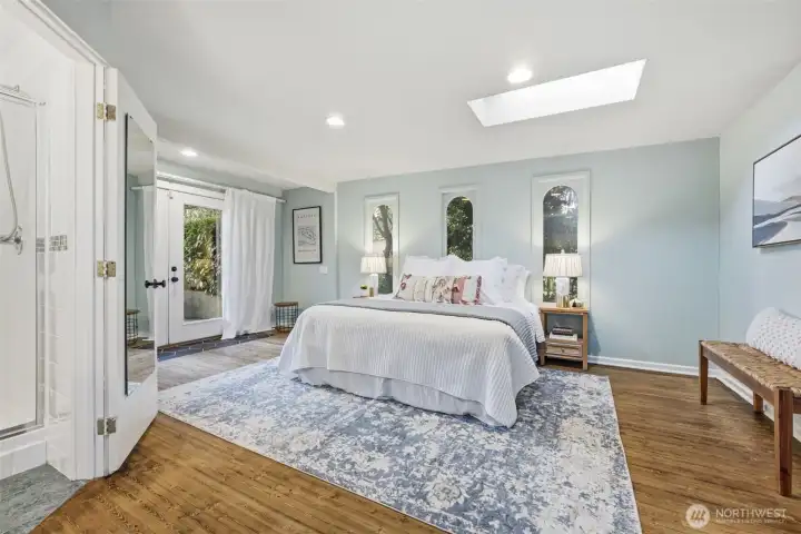 The primary suite is truly a sanctuary inviting you to relax and renew. The French doors open to the super spacious patio along the side of this home.