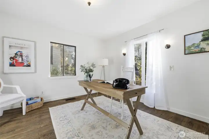 The front bedroom is styled here as a home office.