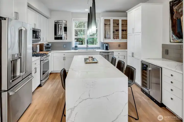 Updated chef's kitchen with quartz waterfall island.